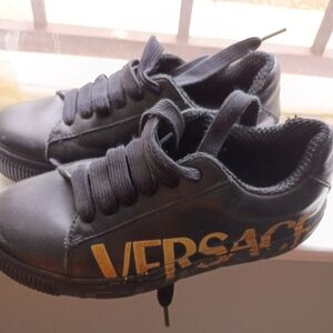 Versace Kids Black and The sole is slightly scratched but otherwise fine.